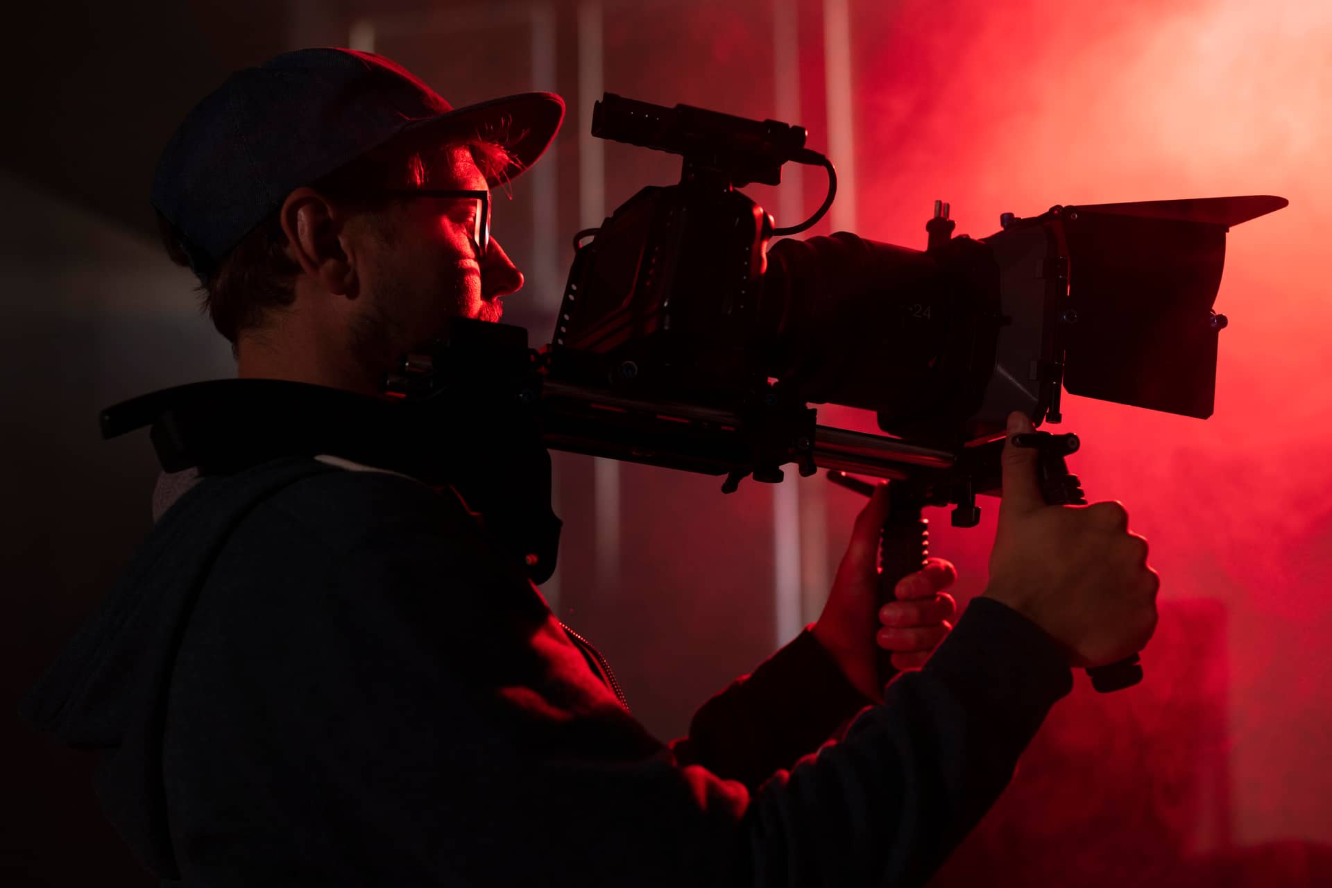 man-filming-with-a-professional-camera